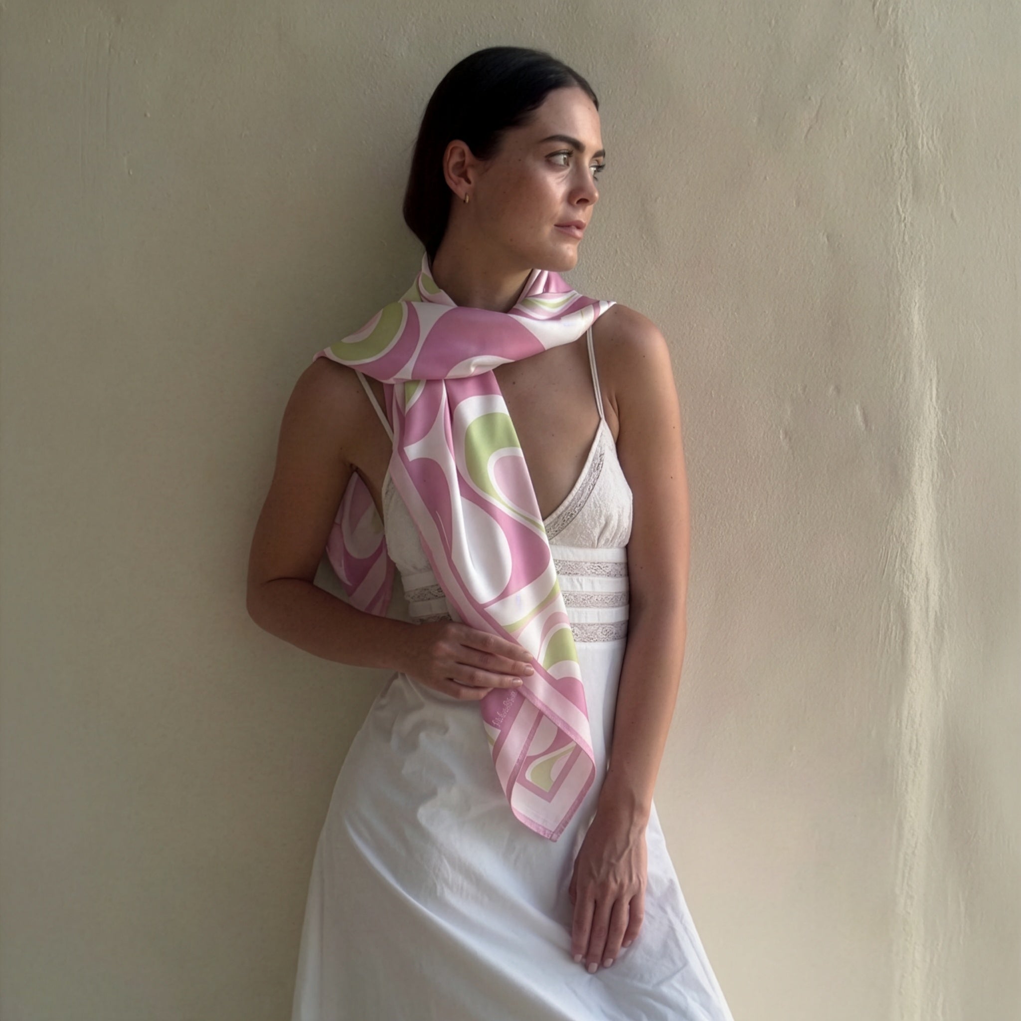woman wearing a scarf designed with pink color